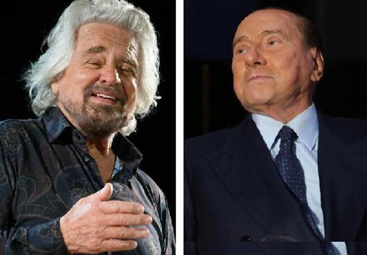 Beppe Grillo e Silvio Berlusconi (Fotogramma)